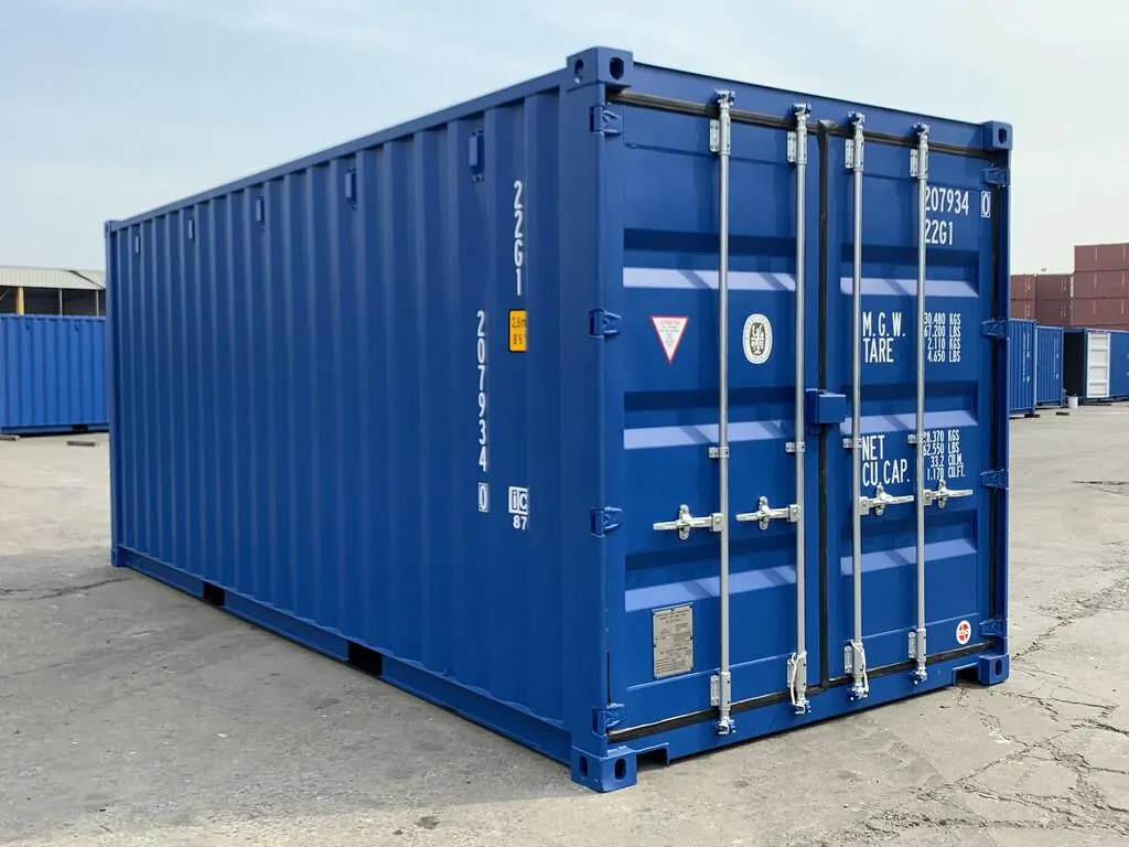 Blue 20 ft container in a yard