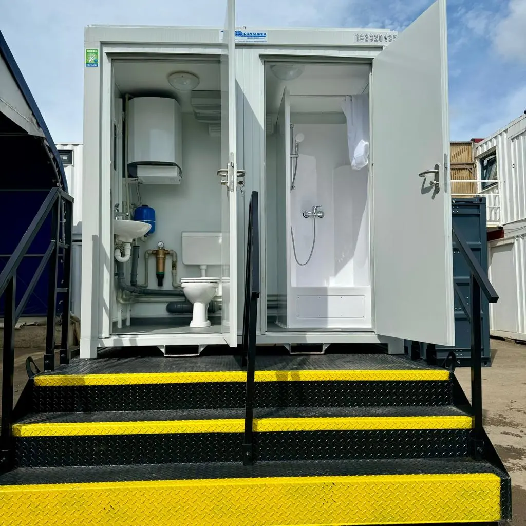 Compact toilet and shower unit